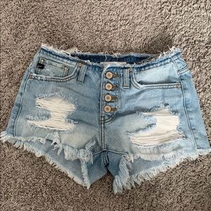 Ripped denim shorts.